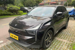 Black SUV parked in a residential area, front view.