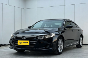 Black Honda Accord mid-size sedan three-quarter front angle shot inside tidy indoor vehicle photography studio