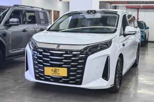White BYD Xia DM-i hybrid MPV front view displayed in indoor used car showroom, sleek grille design, modern family minivan