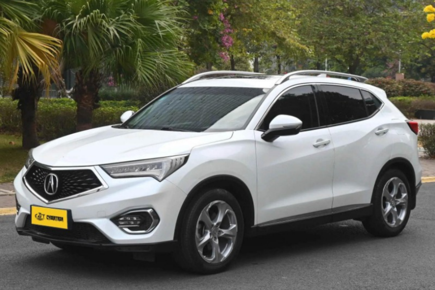 Elegant white Acura SUV: sleek design, reliable performance, ideal for urban commutes & weekend adventures. Premium comfort meets modern driving.