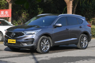 Metallic gray Acura RDX: sleek design, refined details, perfect blend of luxury & practicality for modern driving.