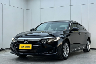 Black Honda Accord mid-size sedan three-quarter front angle shot inside tidy indoor vehicle photography studio