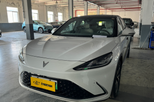 White Neta electric sedan: sleek fastback design, modern EV styling, ideal for eco-friendly urban commuting & smart mobility.