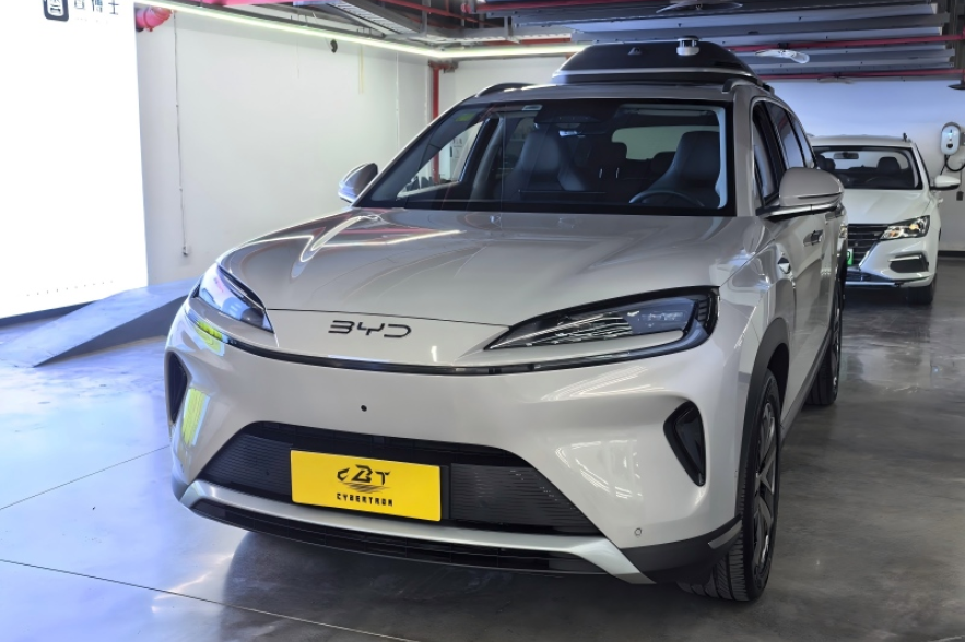 Gloss silver BYD EV crossover featuring streamlined LED headlights and closed electric front grille
