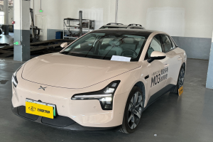 Light pink electric car parked indoors.