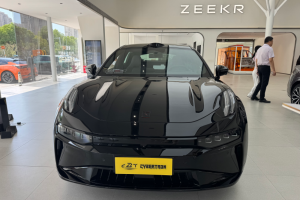 A glossy black Zeekr electric vehicle is prominently displayed in a modern car showroom.