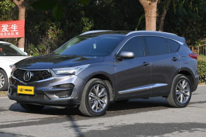 Metallic gray Acura RDX: sleek design, refined details, perfect blend of luxury & practicality for modern driving.
